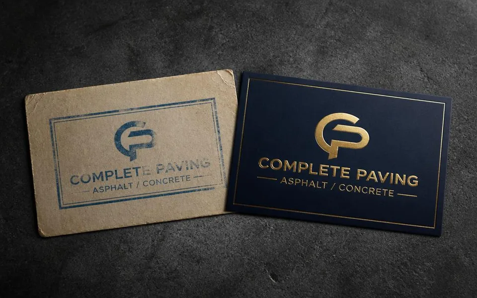 Old worn logo card beside a refreshed navy and gold logo card